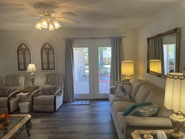 living area featuring wood finished floors and a ceiling fan