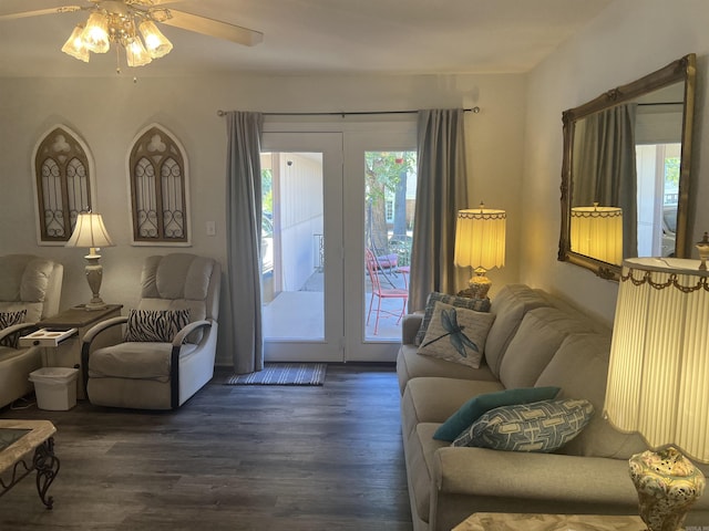 living room with plenty of natural light, wood finished floors, and a ceiling fan