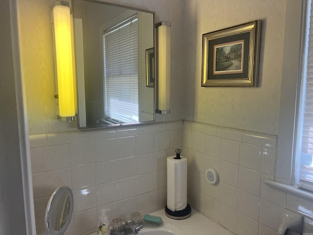 bathroom with tile walls and wainscoting