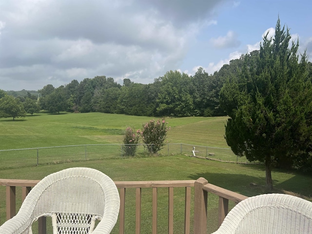 view of yard featuring a rural view and fence