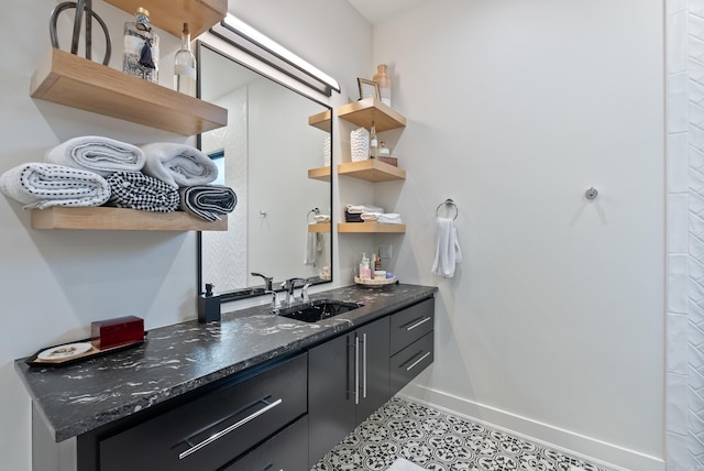 interior space featuring baseboards and vanity