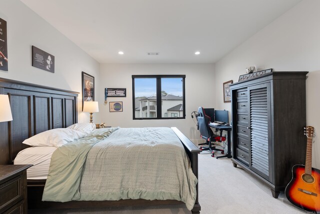 bedroom featuring recessed lighting, visible vents, and light colored carpet