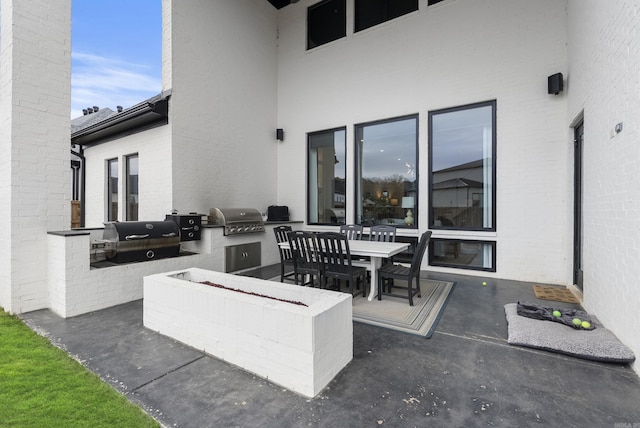 view of patio / terrace featuring outdoor dining area and area for grilling