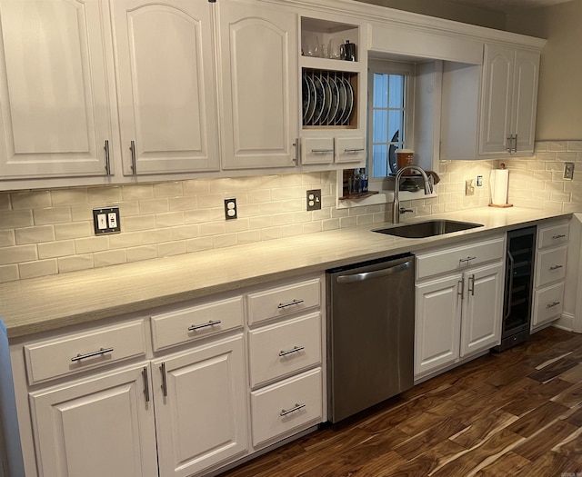 kitchen featuring dishwasher, dark wood-style floors, wine cooler, white cabinetry, and a sink