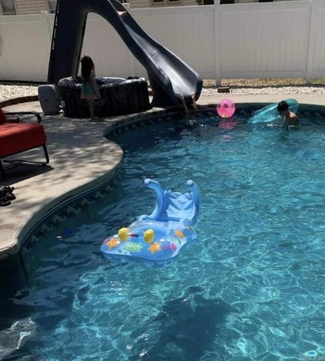 view of pool featuring a fenced in pool and fence