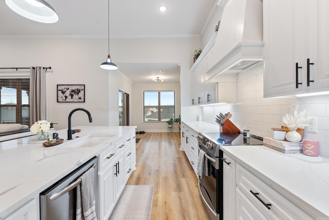 kitchen with custom range hood, backsplash, crown molding, a sink, and range with electric stovetop