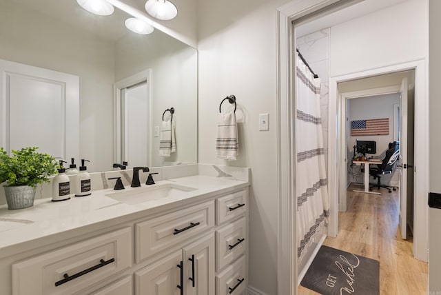 bathroom featuring vanity and wood finished floors