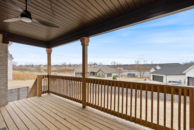 deck featuring a residential view and a ceiling fan