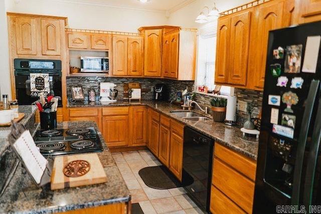 kitchen with black appliances, ornamental molding, decorative backsplash, and a sink