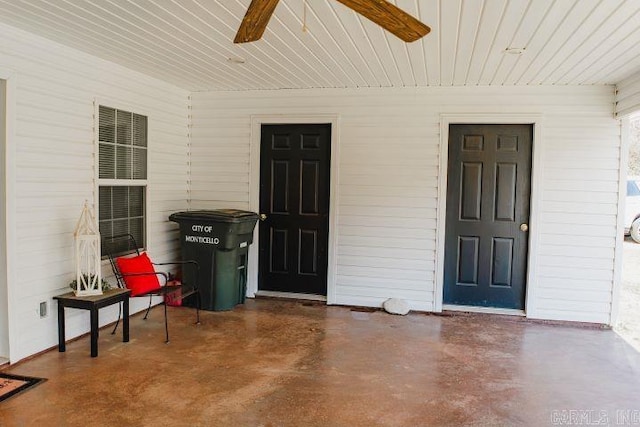 doorway to property featuring ceiling fan