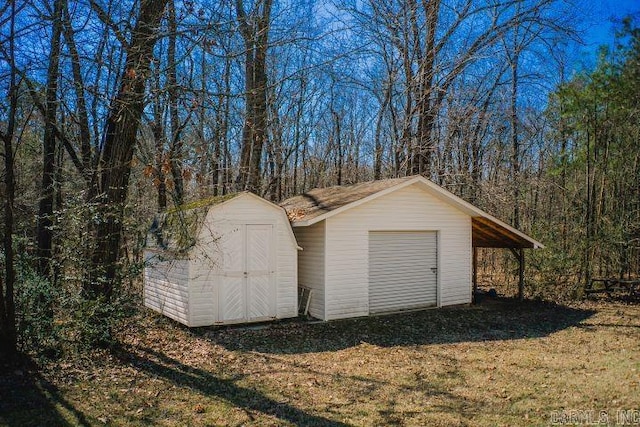 garage featuring a shed