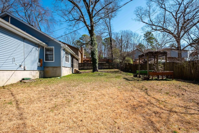 view of yard featuring a fenced backyard and a pergola