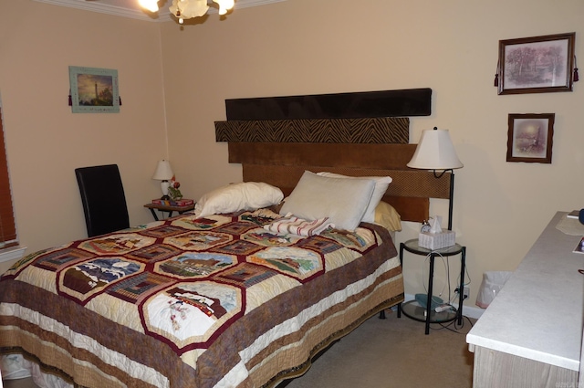 bedroom with a chandelier and carpet