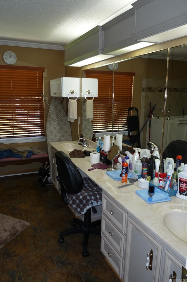 home office featuring crown molding, a sink, and a textured ceiling