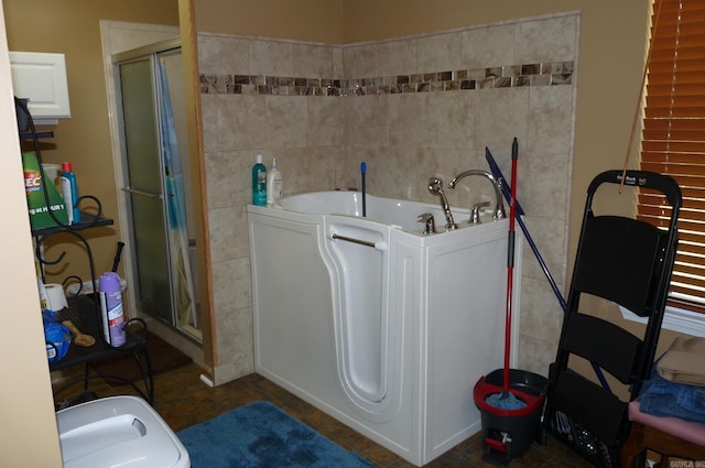 clothes washing area featuring tile patterned flooring and tile walls