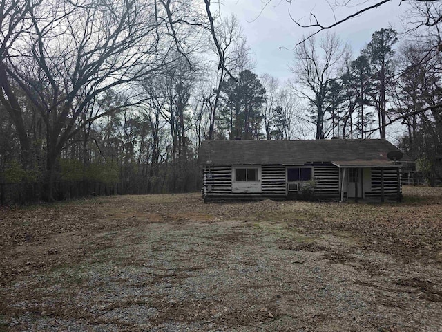 view of front of house with log siding