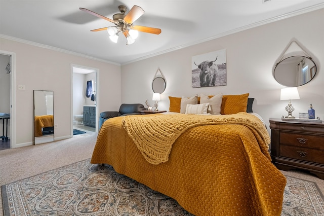 bedroom featuring baseboards, ensuite bath, ceiling fan, ornamental molding, and carpet flooring