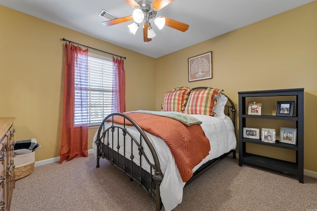 bedroom featuring carpet floors, ceiling fan, visible vents, and baseboards