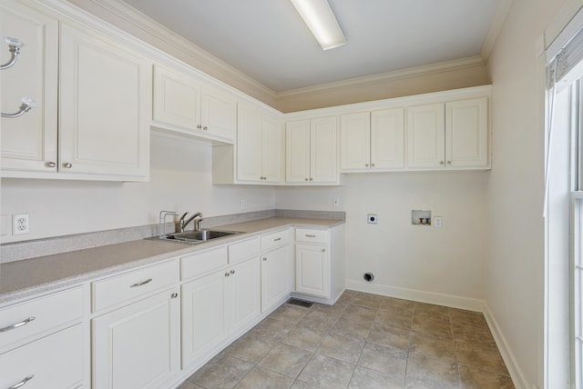 laundry room featuring hookup for an electric dryer, washer hookup, a sink, baseboards, and cabinet space