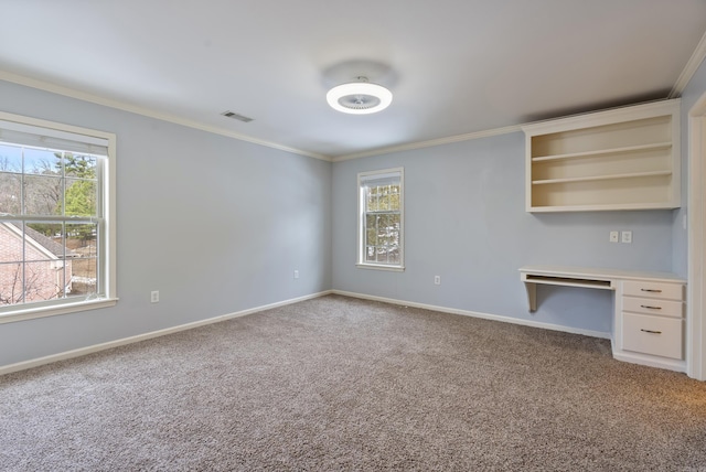 interior space featuring baseboards, carpet flooring, visible vents, and crown molding