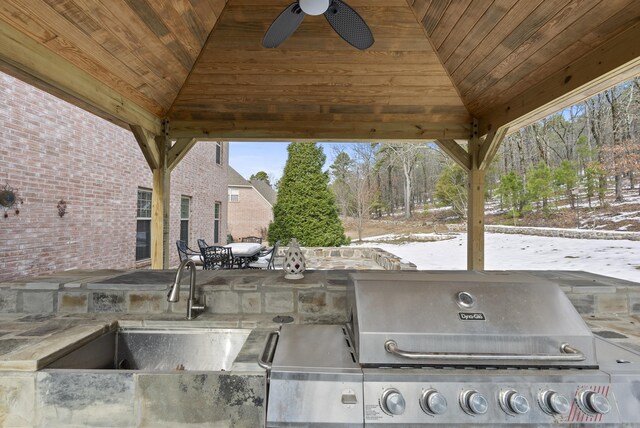 view of patio with area for grilling, a sink, grilling area, and a gazebo