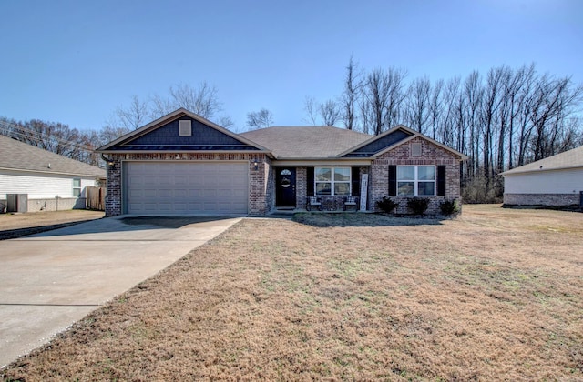 view of front facade featuring a garage, concrete driveway, brick siding, and a front yard