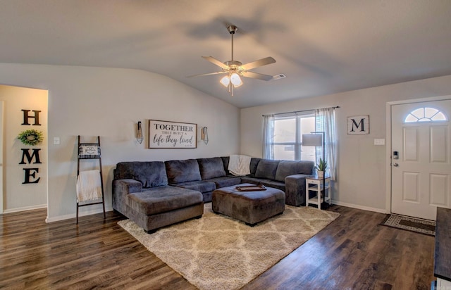 living room with lofted ceiling, a ceiling fan, baseboards, and dark wood-type flooring