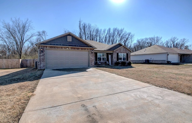 ranch-style house featuring a garage, brick siding, concrete driveway, fence, and a front yard