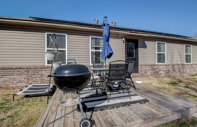 wooden deck featuring outdoor dining space