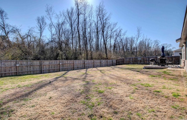 view of yard featuring a fenced backyard and a wooden deck