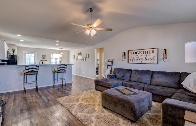 living area with dark wood finished floors, recessed lighting, vaulted ceiling, ceiling fan, and baseboards