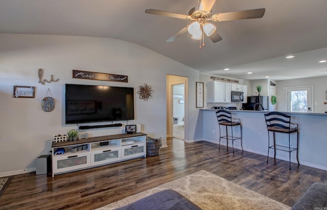 living room featuring ceiling fan, recessed lighting, dark wood-style flooring, baseboards, and vaulted ceiling