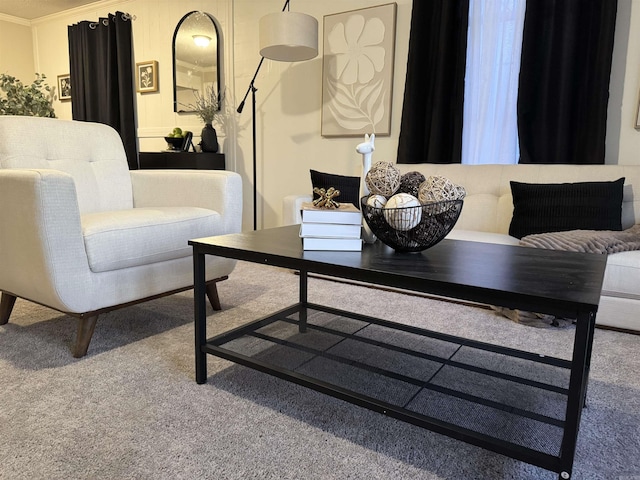 living room with carpet floors and crown molding