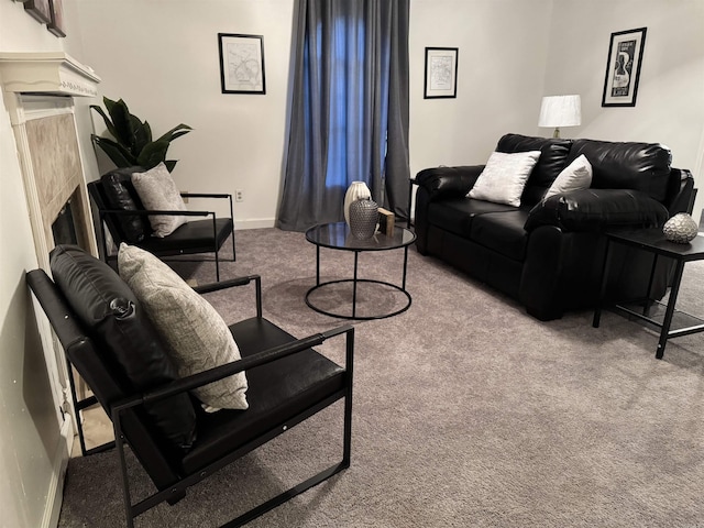 living room featuring carpet floors, a fireplace, and baseboards