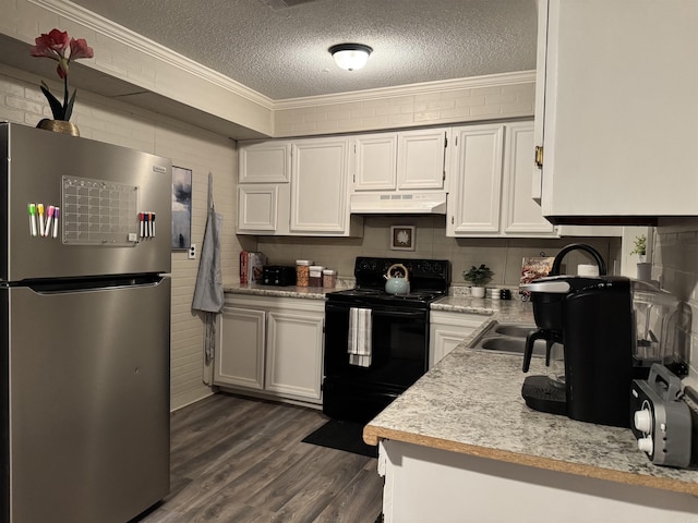 kitchen with light countertops, black electric range oven, ornamental molding, freestanding refrigerator, and under cabinet range hood