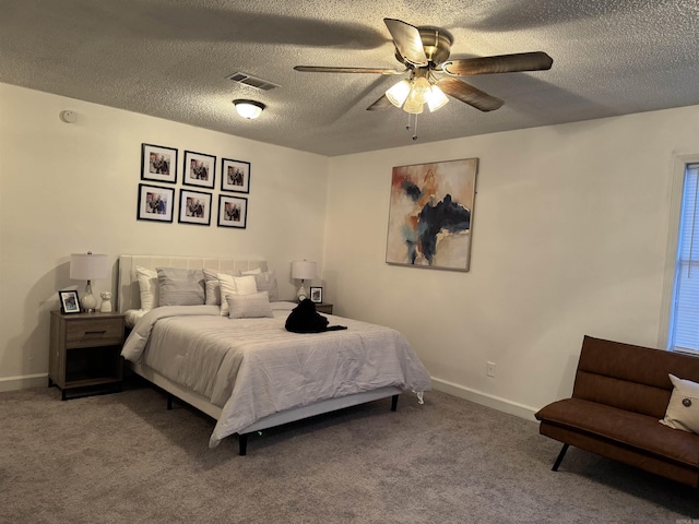 bedroom with carpet floors, baseboards, and visible vents