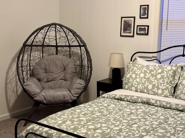 bedroom with carpet flooring and baseboards