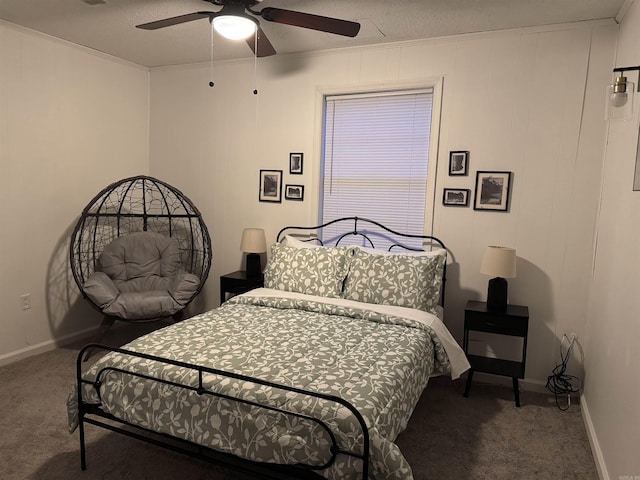 bedroom with carpet, baseboards, ceiling fan, and a textured ceiling