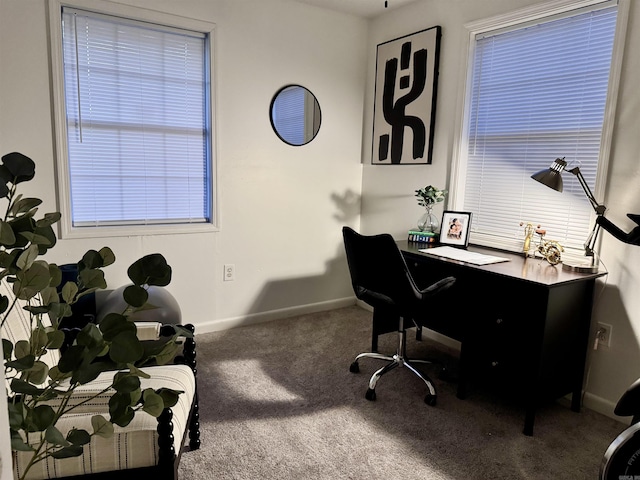 carpeted office featuring baseboards