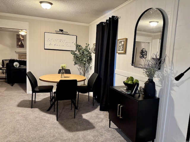 dining area with light carpet, a textured ceiling, and crown molding