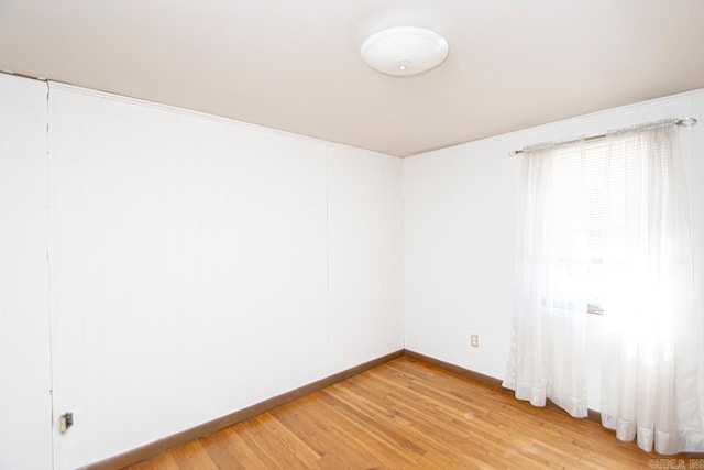 unfurnished room featuring light wood finished floors