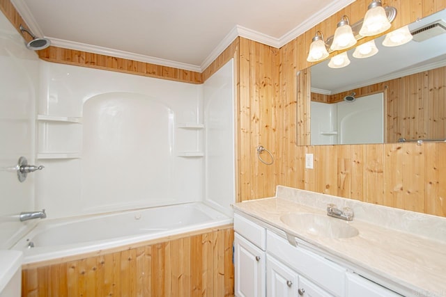 bathroom with ornamental molding, visible vents, bathing tub / shower combination, and vanity