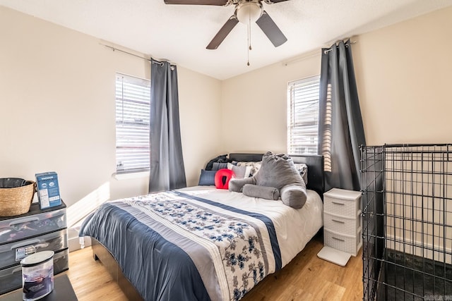 bedroom featuring ceiling fan and wood finished floors