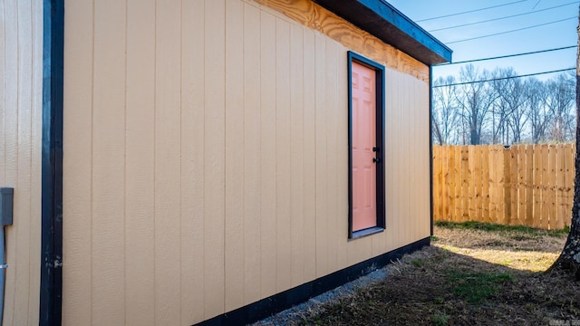 view of side of property with fence