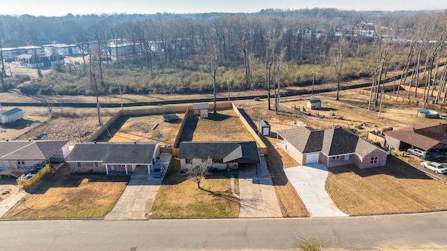 bird's eye view featuring a residential view and a view of trees