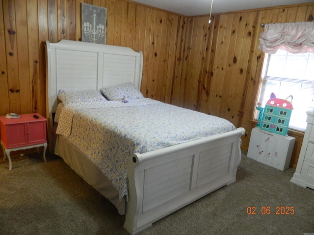 carpeted bedroom with wooden walls