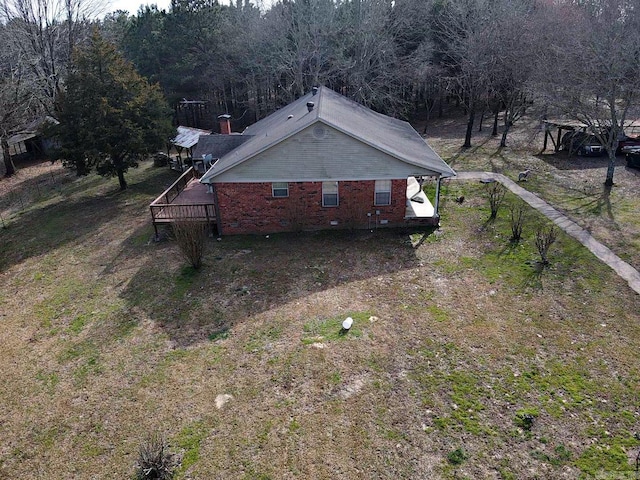 drone / aerial view featuring a wooded view