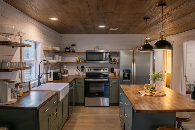 kitchen featuring open shelves, wooden ceiling, appliances with stainless steel finishes, green cabinets, and wooden counters