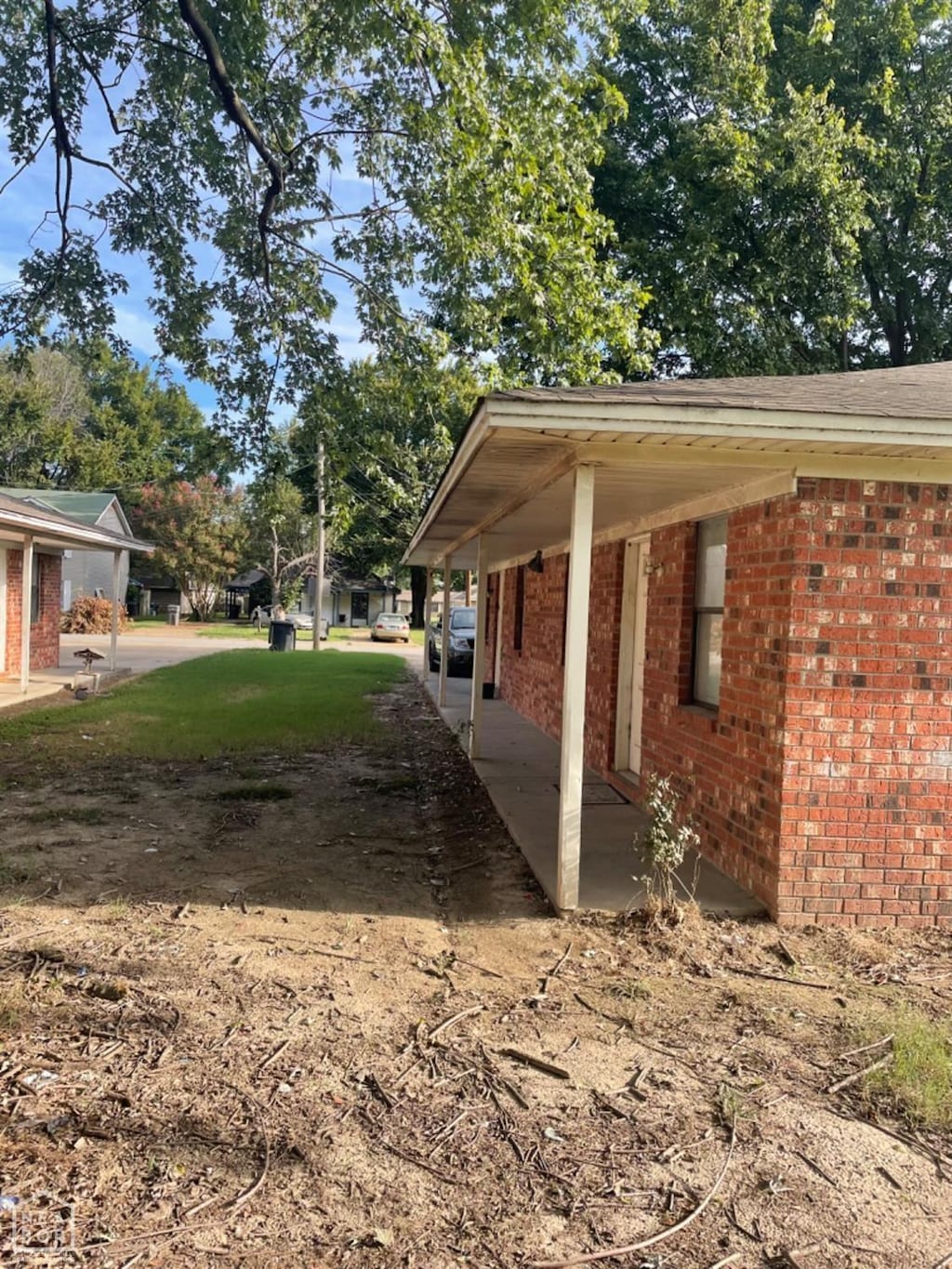 view of property exterior with brick siding