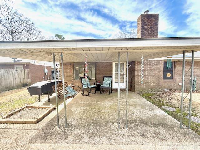 view of patio / terrace with fence